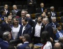 El presidente participó del acto de jura de Lula en el Congreso nacional de Brasil